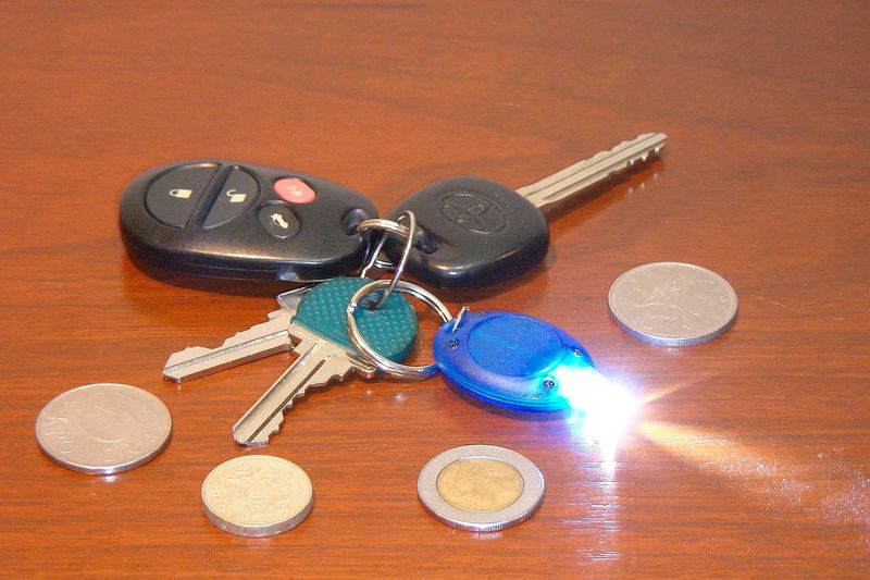 House keys and car fobs on a table
