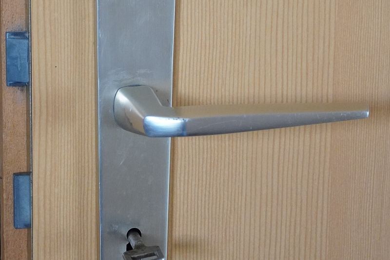 Lever handle with a keyhole on a door